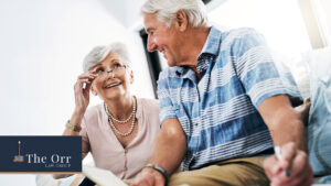 Senior woman and man having discussion while sitting side-by-side